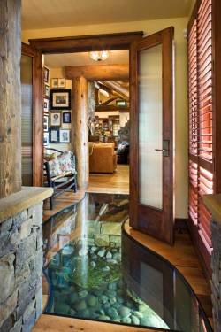    The foyer in a house built over a creek, in Wyoming. Built