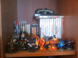 Skylanders have taken up most of the top shelf of the cabinet-thing