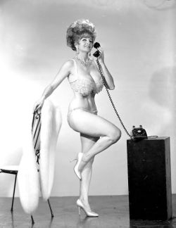 Tempest Storm takes an important phonecall.. A late 60’s-era