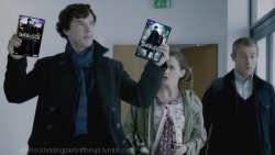 sherlockholdingpairsofthings:  This is what Moriarty actually meant when he said â€œItâ€™s on DVD.â€  Sherlock Holding Pairs of Things Week: Day 2