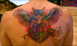 fuckyeahtattoos:  The original design for this piece was a needlepoint my Grandma made about 40 years ago.  It was 4 owls, her and her three daughter, all perched on a olive branch.  I brought my artist the needle point and he redrew it.  Although