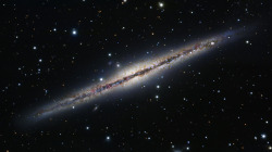 NGC 891 (also known as Caldwell 23) is an edge-on unbarred spiral