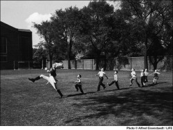 Children follow the Drum Major at the University of Michigan,