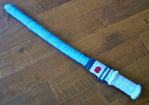 nerdycrochet:  Light saber!! XD You could probably put some kind of rod inside it too keep it from drooping (free pattern!).  I think I know who to make this for~