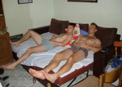 bestofbromance:  pull-out sofa bed bros, obviously watching something… 
