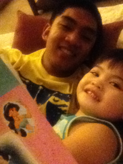 Reading my baby sister a Disney Princess bed time story cuz she’s