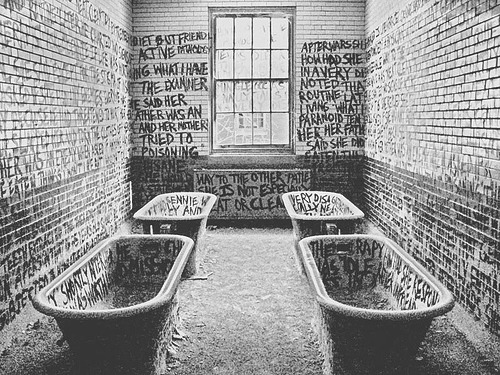   Graffiti in an abandoned mental institution.  this is haunting  i love things like this!