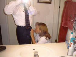 milkthatcock:  Sucking her husband in the guest bathroom of their