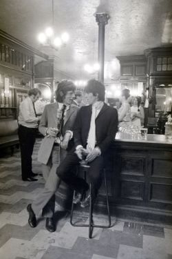 theswinginsixties:  Mick Jagger and Keith Richards toasting their