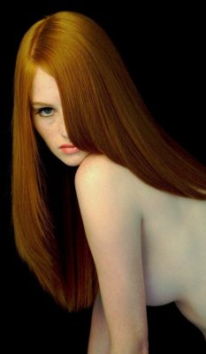 shapesiminlovewith:  Sexy redhead staring from behind a wall of hair.