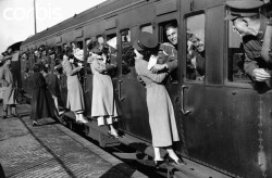  Soldiers leaning out of train windows to kiss their girls goodbye