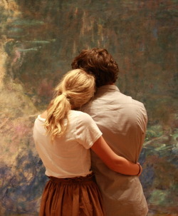 micaceous:   A couple admires the color and texture of Monet’s