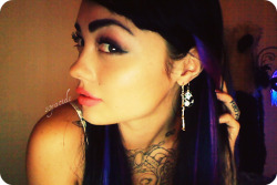 soyacide:  blurple hair and thick eyebrows 