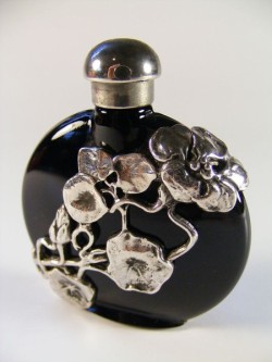 detail-detail-detail:  Vintage perfume bottle with silver overlay,