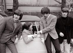  A picture of John Lennon getting his drivers license, and also