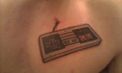 fuckyeahtattoos:  Shortly after being finished. My NES controller