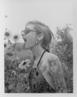 flower eater!!! polaroid by Andy Reaser, model Theresa Manchester