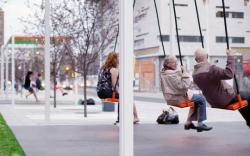  A bus stop with swings 