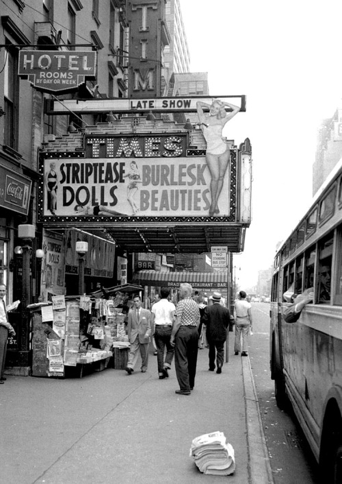 STRIPTEASE DOLLS – BURLESK BEAUTIES A vintage photograph from 1955 highlights the marquee of the ‘TIMES Theatre’, in New York City..  