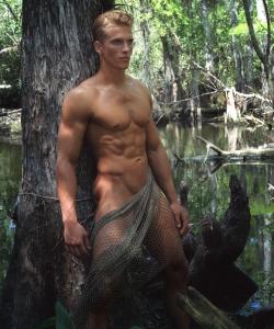 Found this photo from 2006 and it's totally Finnick Odair from Catching Fire!Ian McIntyre in &ldquo;Amazonia&rdquo; by Peter D. Brown for Envy Man magazine.More hot photos here.