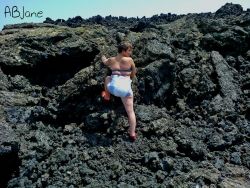 abjane:  This photo was taken while I was on holiday in Lanzarote. We hired a car for the day and set off to find some quiet places to take photos of me in my nappy. We drove into the Timanfaya National Park where the landscape was entirely volcanic.