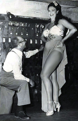     Lois DeFee    aka. “Queen of the Amazons”.. A press photo from 1949, features Lois backstage with Bill Wheeler of the Wheeler-Pittman theatrical agency. The accompanying caption describes Ms. DeFee as: &ldquo;definitely NOT a stripteaser..&rdquo; 