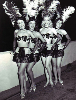 Vintage candid 50’s-era photograph of showgirls backstage,