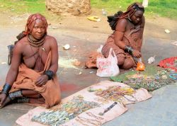 theincidentaltourist:  It surprised me to see these Himba women selling their crafts near the Swakopmund Lighthouse. It’s unusual for these striking Nomadic people to be found so far south. They were dressed in traditional clothing, their hair was beautif