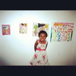 Beja and her art at the show last month. She sold everything!