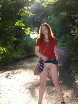 Gorgeous redhead lifting her skirt outside so we can see her