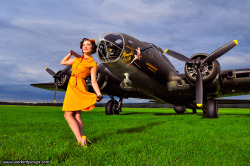 Military plane with a beautiful brunette