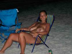 nudistlifestyle:  Lovely tanned and busty nudist at the beach ! 