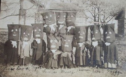 odditiesoflife:  Vintage Photo of Children in Black Pillow Case