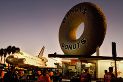 Endeavour stops in front of Randy’s Donuts on Manchester