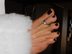 Deep Purple Polish.Â  Feet in fuzzy restraints.