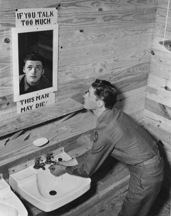 kruegerrossi:  U.S. soldier looks into washroom mirror with sign