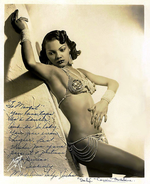 Sahji     (aka. Madeleine Jackson) Beautiful vintage 30’s-era promo photo of Ms. Jackson, who was a Feature dancer at NYC’s famed ‘Cotton Club’ nightspot from 1933 to 1939.. She personalized the photo to a fellow dancer: “To