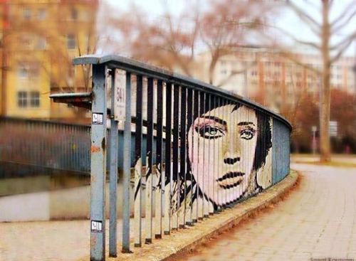 Perspective street art on a railing … that is one talented artist