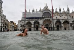 calebostgaard:  A young man and a woman enjoy swimming in flooded