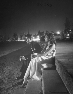 fuckyeahvintage-retro:  A soldier sitting with a date at a Servicemen’s