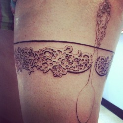 fuckyeahtattoos:  My lace garter, in progress. I am a chef and