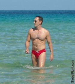 wrestlerswrestlingphotos:  hot beach man swimming ocean hairychest