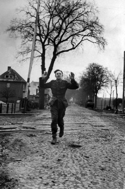 itsjohnsen:  A young German soldier gives himself up during the