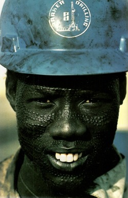 vintagenatgeographic:  Nuer tribesman wears a hard hat for his
