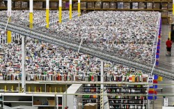 Lost in Amazonia (an employee walks an aisle of Amazon’s 1.2 million square foot “fulfillment center” warehouse in Phoenix)