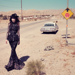 Lonesome girl road trippin’ ~ Model Querelle Jansen cuts a mysterious figure in the latest work by photographers Sofia Sanchez and Mauro Mongiello. Fearless, hitting the road, she is drama personified, standing out starkly against a desert landscape with