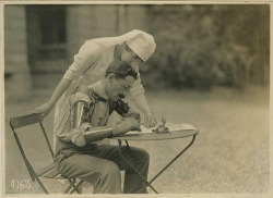 aegrotantem:  A nurse teaching a French soldier with two newly