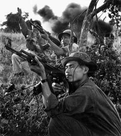 vietnamwarera:  North Vietnamese soldiers firing upon an American