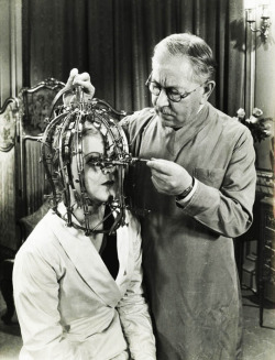 Max Factor demonstrates his scientific device the Beauty Micrometer