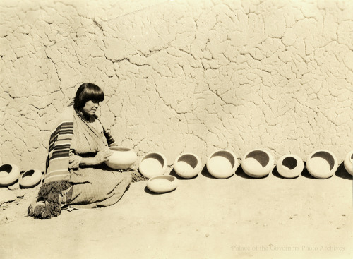 Artist Maria Martinez with display of her pottery, San Ildefonso Pueblo, New MexicoPhotographer: Eld